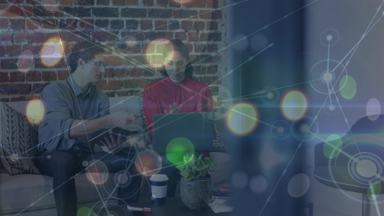 Animation of network of connections with icons over diverse business people talking