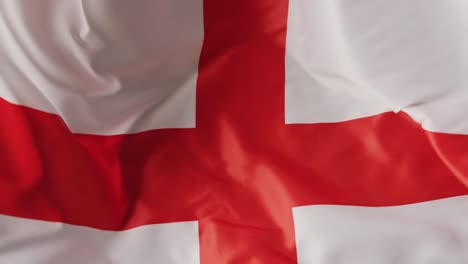 Animation-of-football-over-flag-of-england-with-copy-space