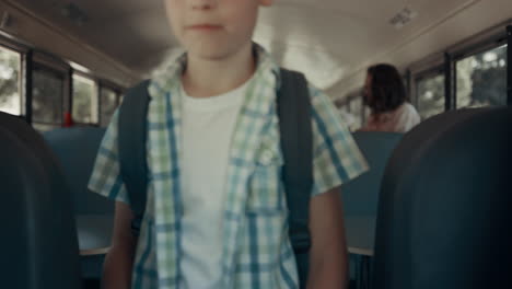 Happy-multiethnic-students-leaving-school-bus.-Children-walking-vehicle-aisle.