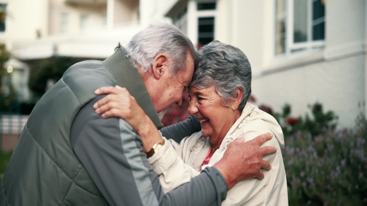 Elderly couple hugging with love and affection