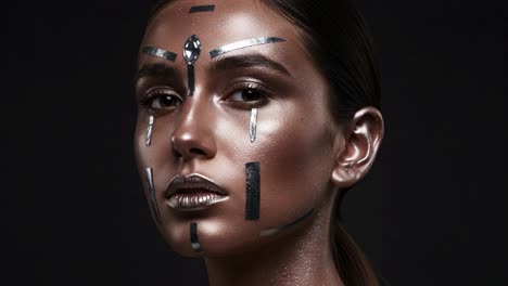 a stunning portrait showcasing an artistic makeup look, featuring intricate metallic designs and a gleaming finish against a dark background