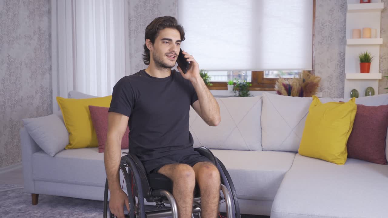 Physically disabled man talking on the phone.