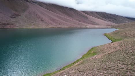 sunny-morning-view-of-Chandra-Taal-Lake-in-India-with-no-people,-aerial-landscape