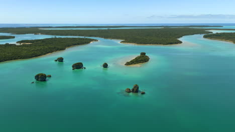 Aerial-parallax-around-famous-floating-rocks-in-Upi-Bay,-Isle-of-Pines,-New-Caledonia