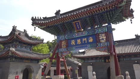 ancient chinese temple buildings surrounded by modern city