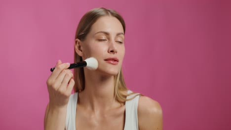 woman applying makeup