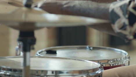 close up view of professional black drummer playing drums