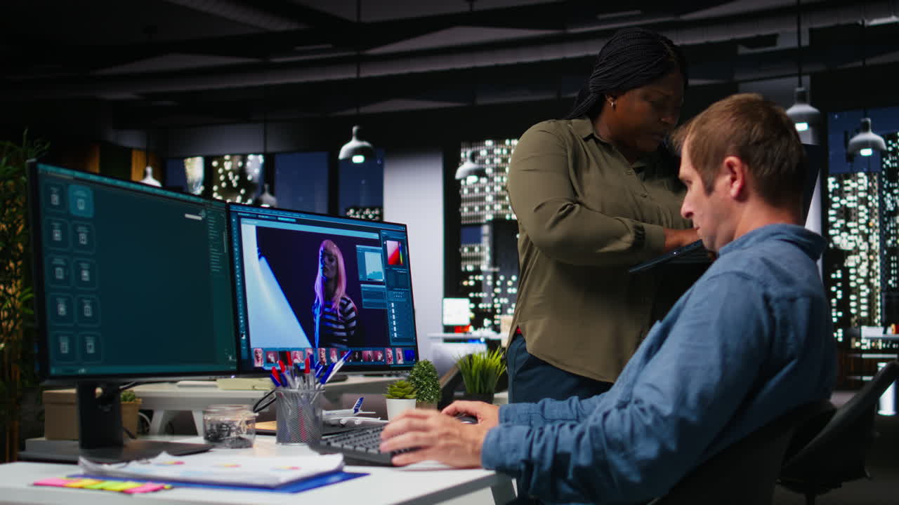 Team of graphic designers retouching photos with software and chatbot