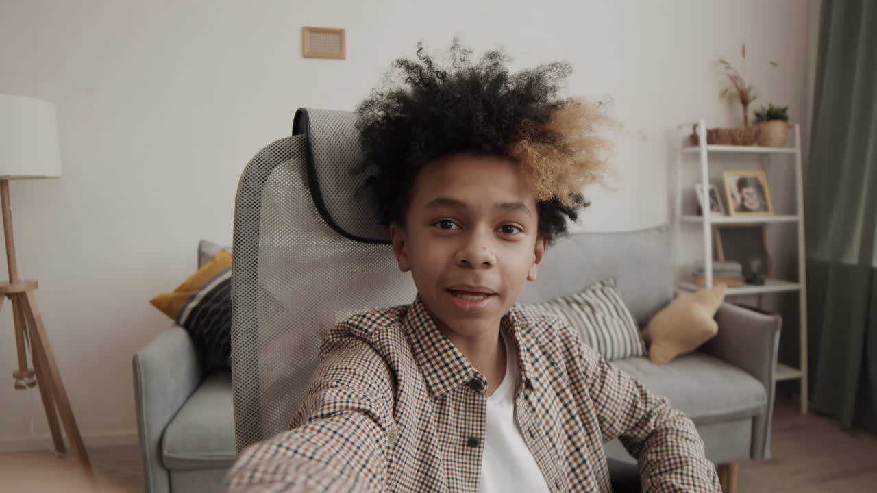 Afro Teenage Boy Talking on Camera