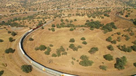 Train-on-a-railway-in-Tehachapi-California---Aerial-View