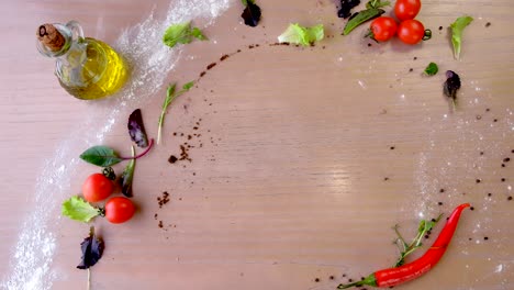 chef in rubber gloves takes pizza salami on a wooden board from the table.