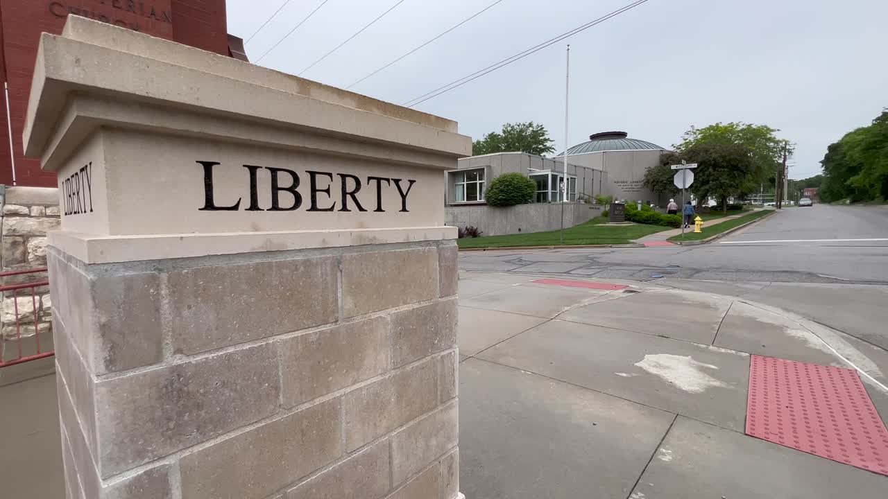 Road Marker to Liberty and Liberty Jail a Mormon Visitor Center Where Joseph Smith was held captive for Months in Liberty Missouri