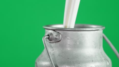milk is poured into a can with air bubbles.