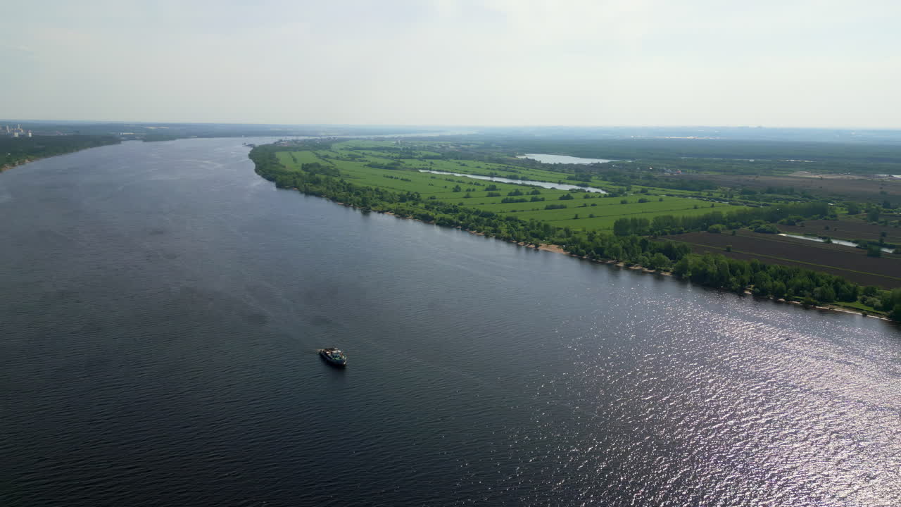 Aerial View of a Wide River Landscape with a Boat
