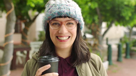 Happy-woman-enjoying-coffee-while-out-traveling