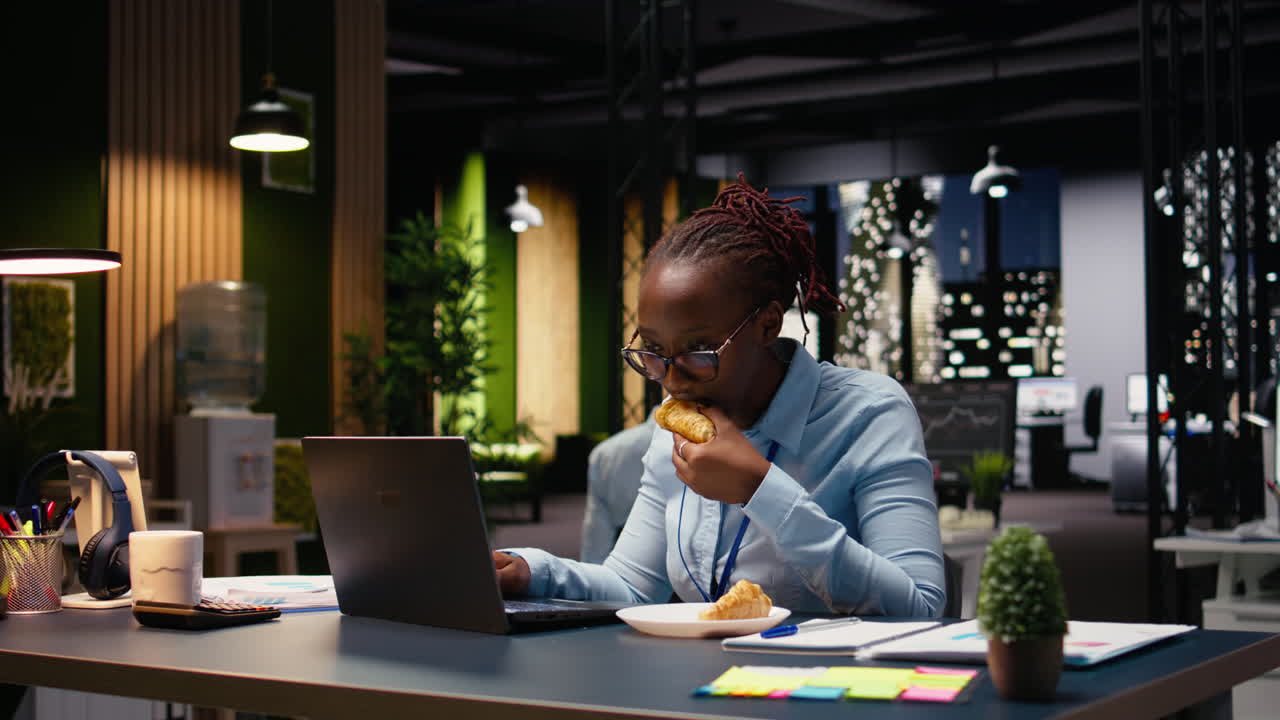 Eating disorder and emotional stress, black woman working on laptop