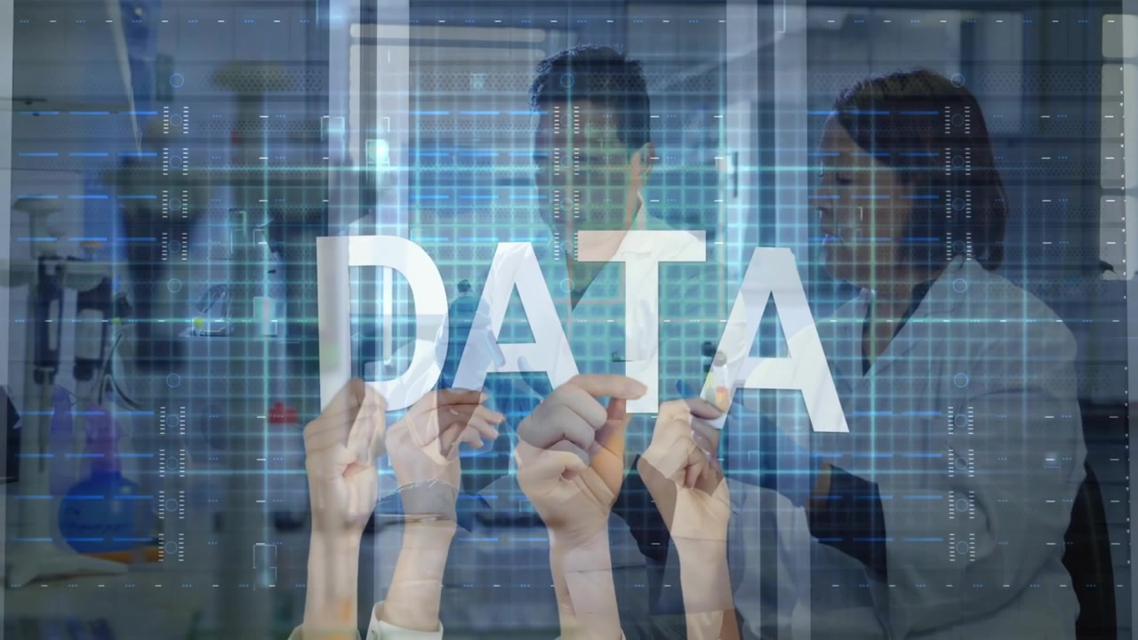 Hands entering and aligning DATA letters for science data visualization, scientists monitoring grid