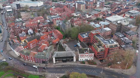 norwich norfolk with historic churches, shops, streets, and red-roof buildings, aerial view