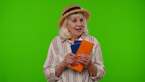 traveler tourist senior woman holding passport tickets dreams of which country go rest on vacation