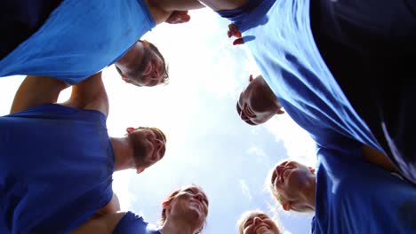 fit people standing together and forming a hurdle 4k