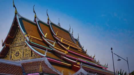 Illuminated Thai Temple Roof at Twilight