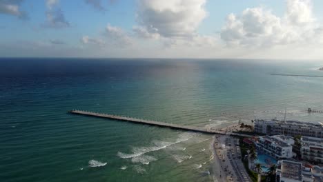 beautiful pier in peaceful blue seascape, playa del carmen, mexico
