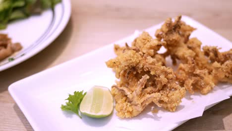 detail of fried squid tentacle dish - tempura, in a restaurant