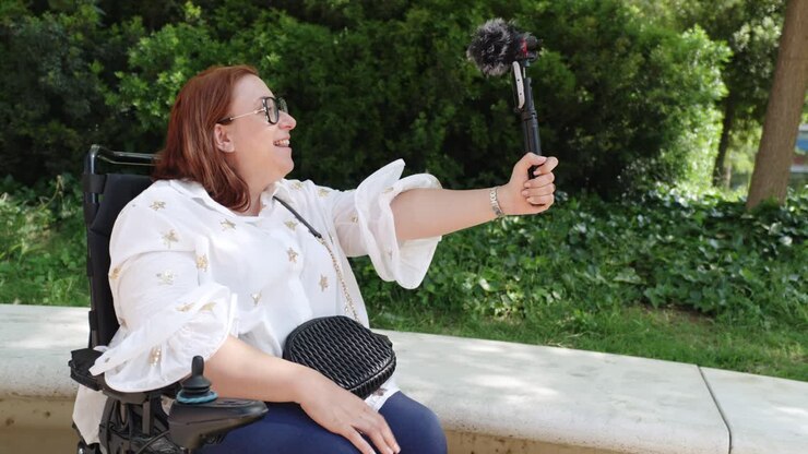 Woman in Wheelchair Vlogging Outdoors