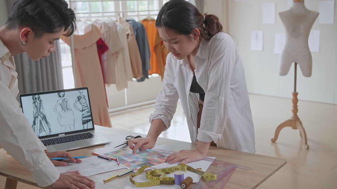 Fashion Designers Collaborating on a Design