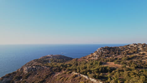 scenic view of the mediterranean coastline from a hillside at sunset