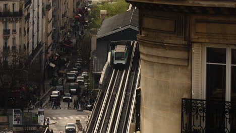 train departing from station with view of daytime traffic and crossing pedestrians in paris, france