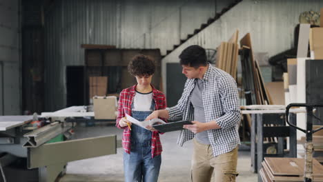 woodworking team discussing design plans