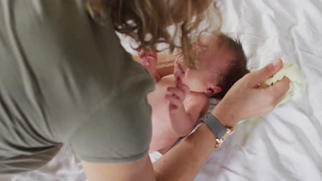 Video-of-caucasian-mother-taking-care-of-newborn-baby
