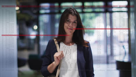 business data analysis animation over woman walking in office building