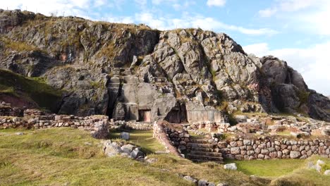 Slow-motion-view-pan-left-to-right-over-the-ancient-archaeological-site-the-Moon-Temple-in-Cusco,-Peru-during-daytime