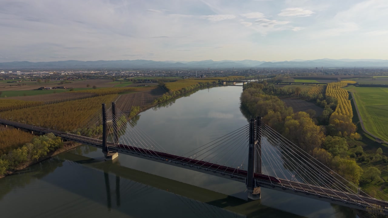 Railway strallato bridge over Po River aerial Piacenza Italy