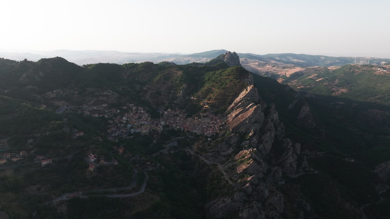 Drone footage of Castelmezzano, Italy. Picturesque mountain village with dramatic cliffs, historic charm and breathtaking views. Ideal for travel, tourism, destination and cultural stock footage