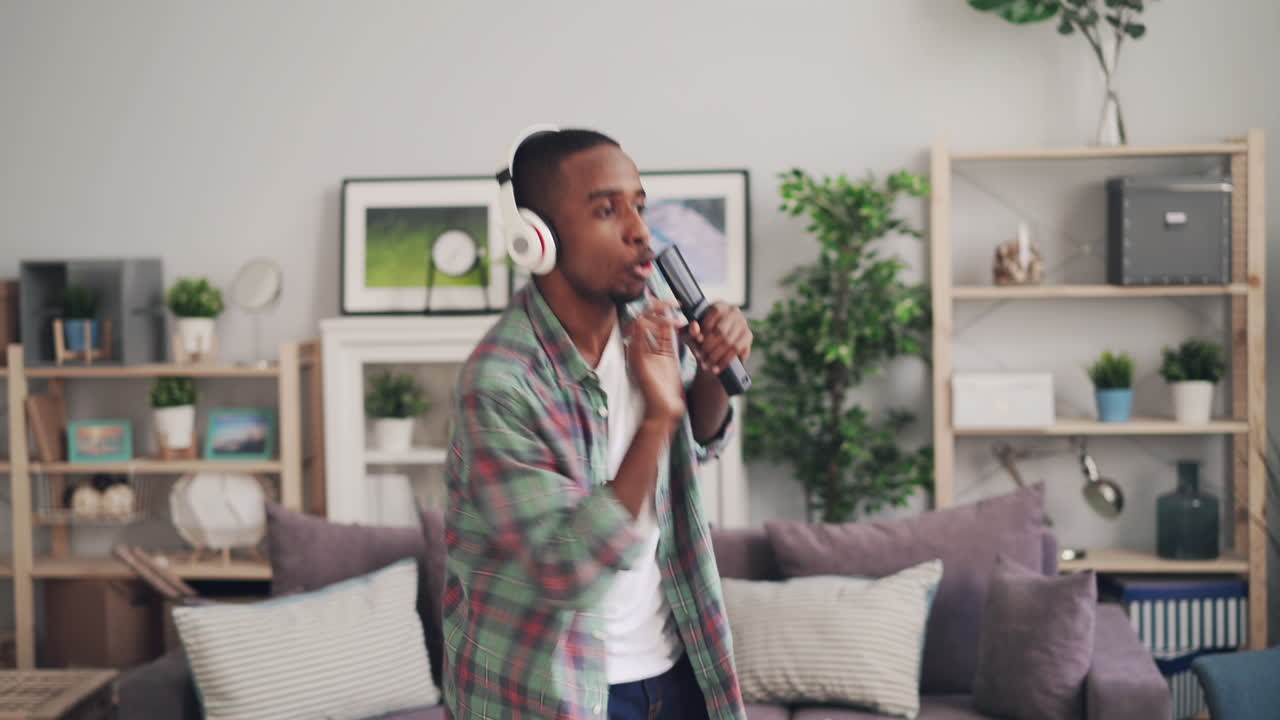 Man Singing and Dancing in Living Room