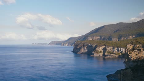 wild sea cliffs and calm ocean