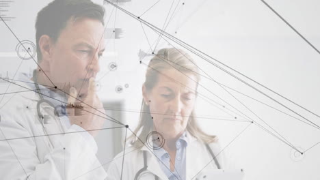 two doctors reviewing medical data in modern clinic, with floating nodes and waveform charts