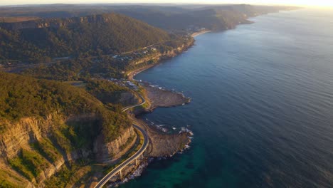 Panorama-Of-A-Forest-Sandstone-Hills-With-Road-Bridge---Sea-Cliff-Bridge-Along-Grand-Pacific-Drive,-New-South-Wales,-Australia