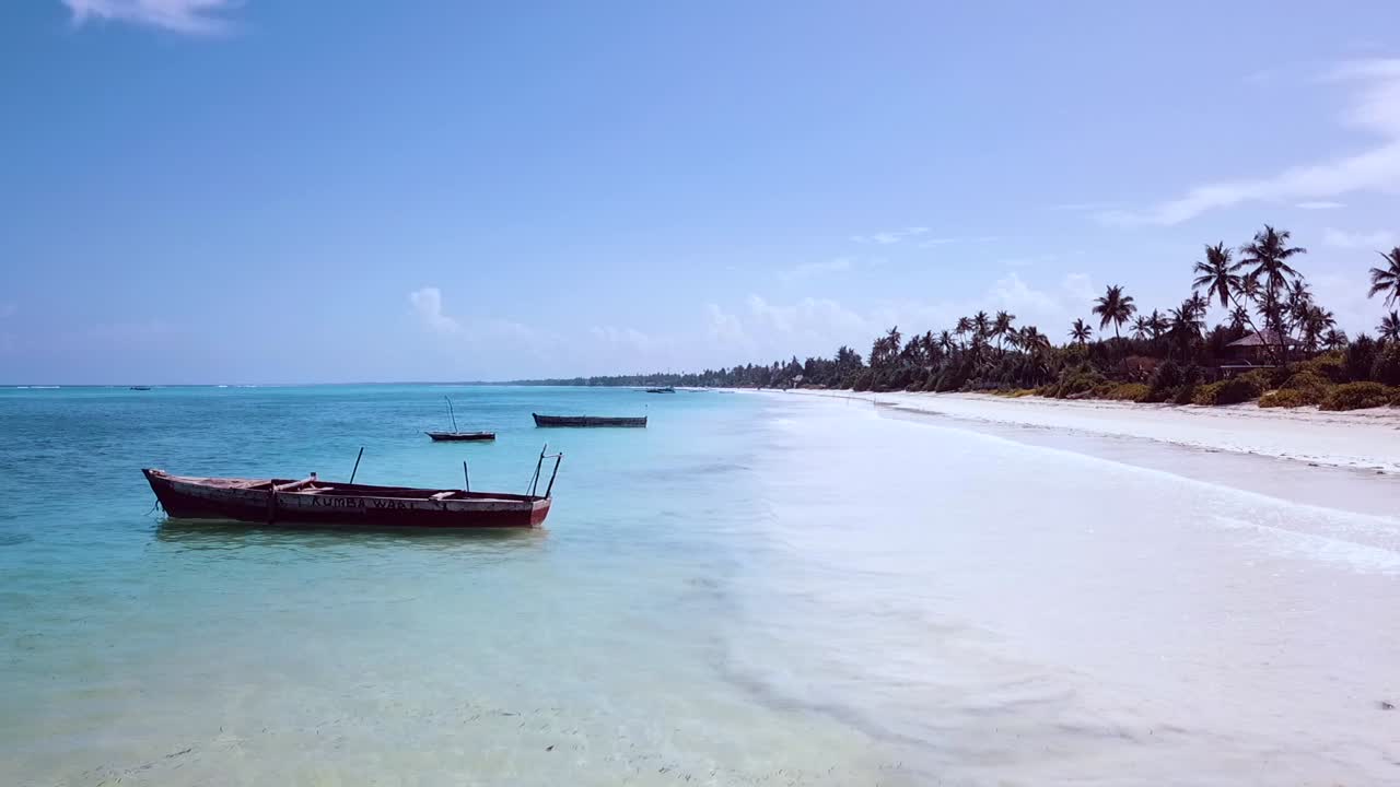 Perfect aerial flight stable tripod slow motion drone shot of lonely fishing boat in turquoise water