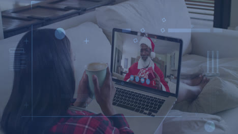 animación de formas abstractas sobre una mujer afroamericana que tiene una llamada de video en una computadora portátil en casa