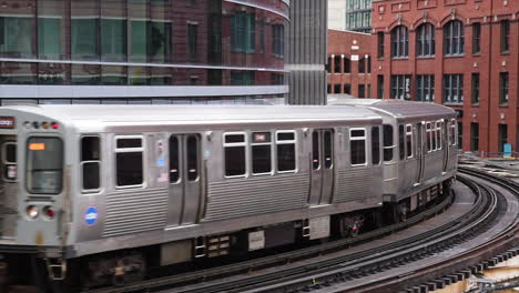 metro train passing in downtown chicago, illinois, usa