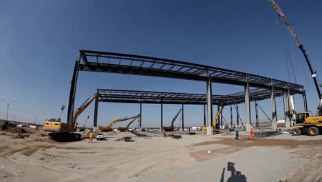 construction site with heavy equipment and workers