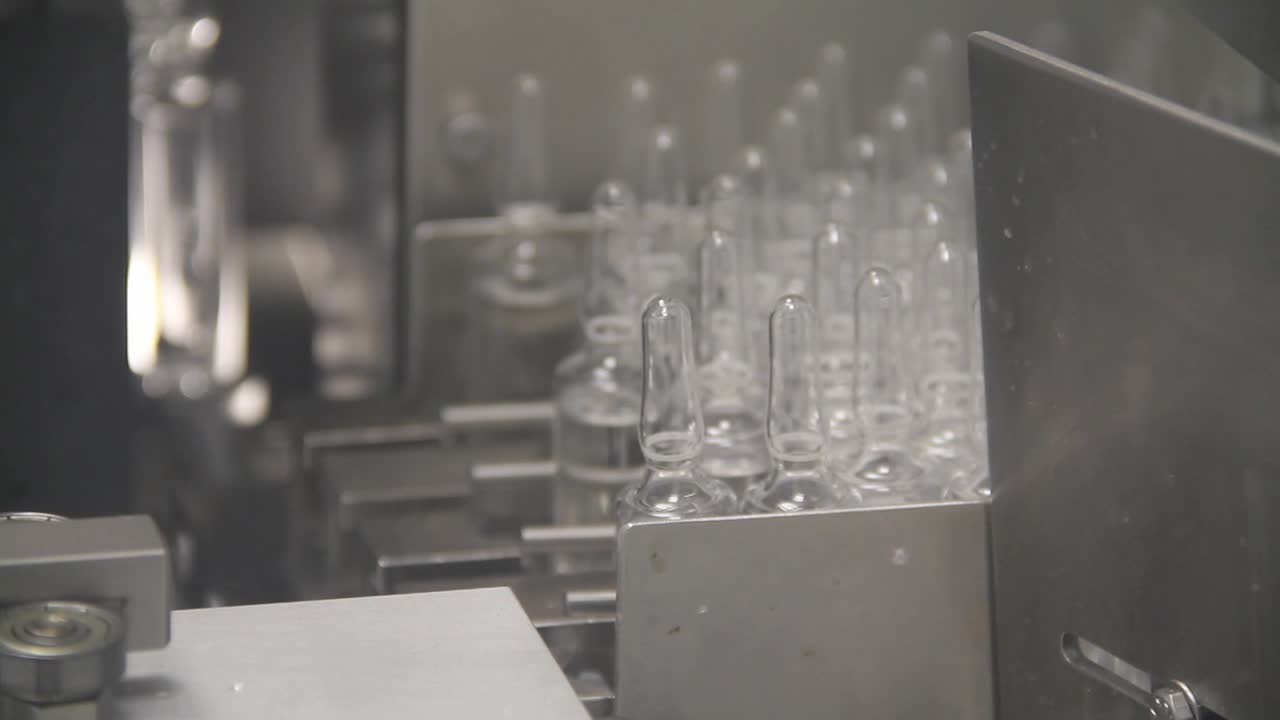 Checked medicinal vials being transported to the rest of the approved batch.