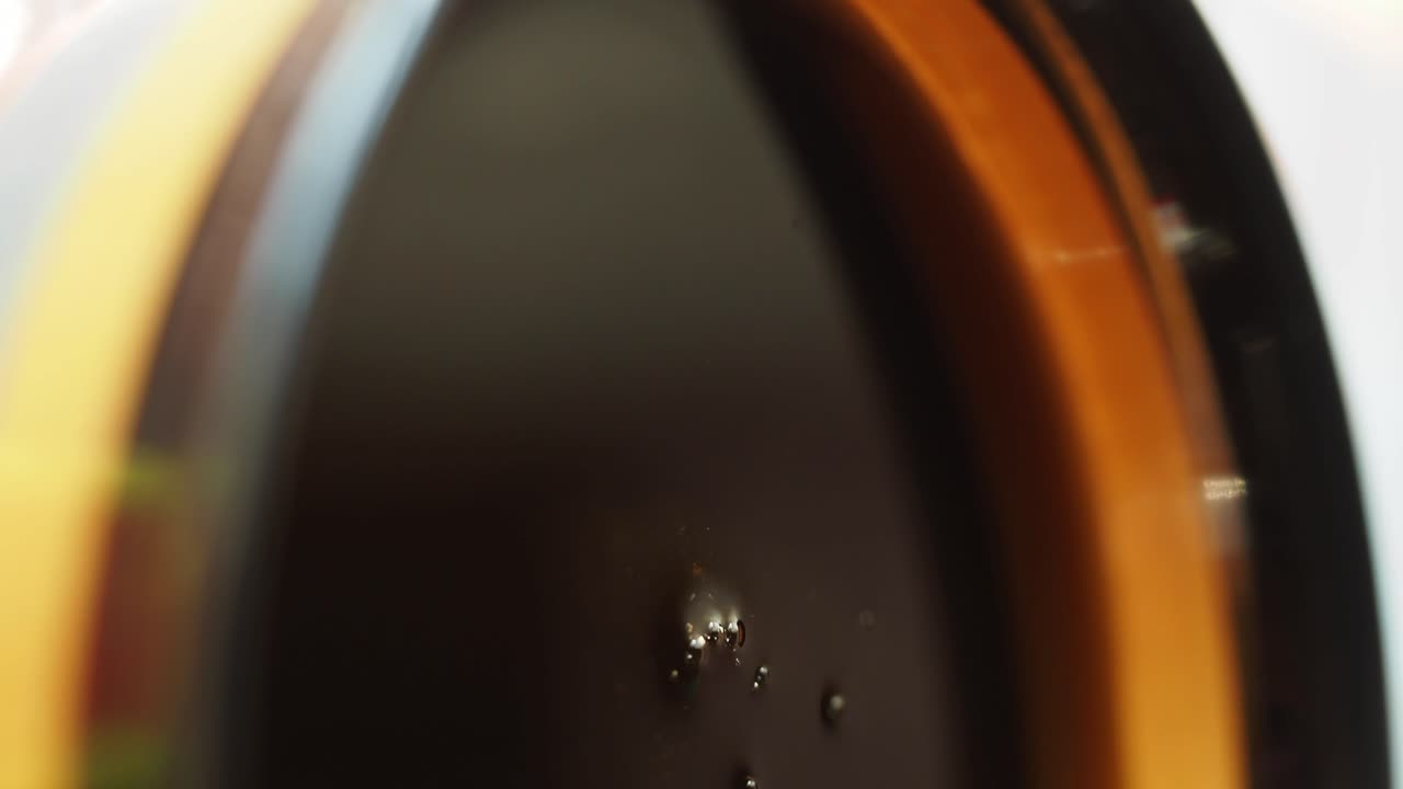 Close-up of Dark Liquid with Bubbles