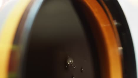 close-up of dark liquid with bubbles