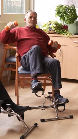 senior men and women doing pedal exercises and lifting dumbbells at rehabilitation center