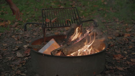 slow motion footage of a fire in a fire ring at a campground